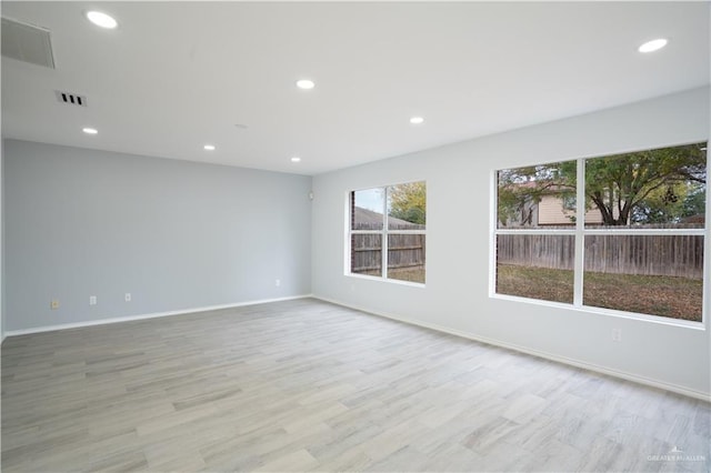 unfurnished room featuring light wood-type flooring