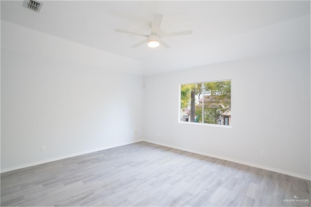 unfurnished room with ceiling fan and light wood-type flooring