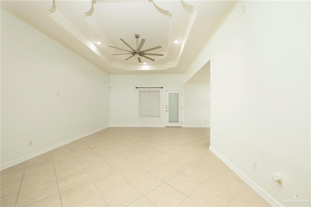 1710 Christian Cir, Harlingen, TX 78550 - unfurnished room featuring a raised ceiling, a ceiling fan, recessed lighting, baseboards, and light tile patterned flooring