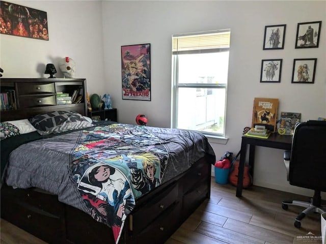 bedroom with wood-type flooring