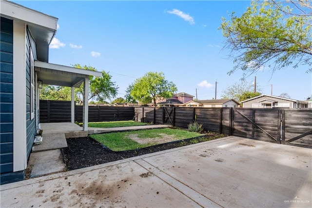 view of patio with a fenced backyard and a gate