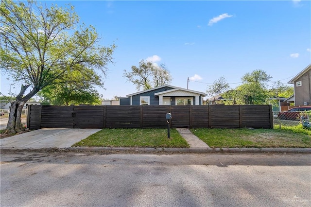 bungalow with a gate and a fenced front yard
