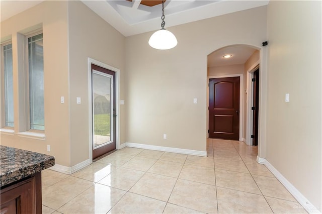 unfurnished dining area featuring light tile patterned floors