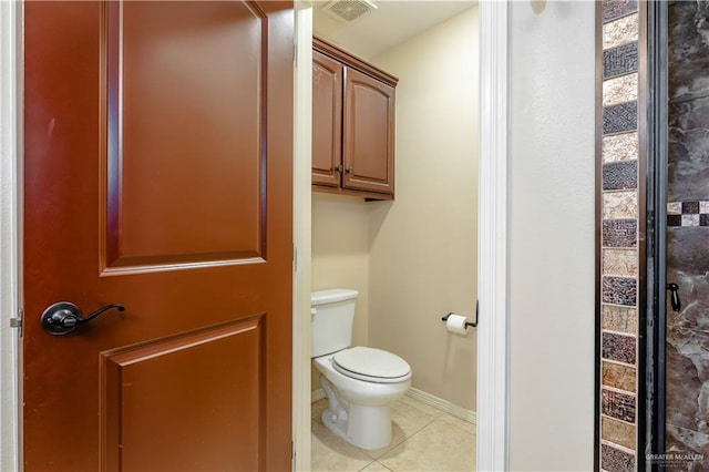 bathroom with tile patterned floors and toilet