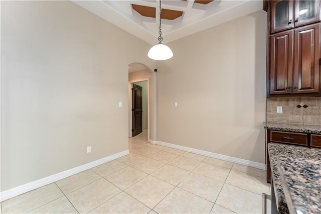 unfurnished dining area featuring light tile patterned floors