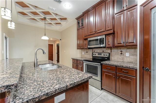 kitchen with decorative light fixtures, sink, dark stone countertops, coffered ceiling, and stainless steel appliances