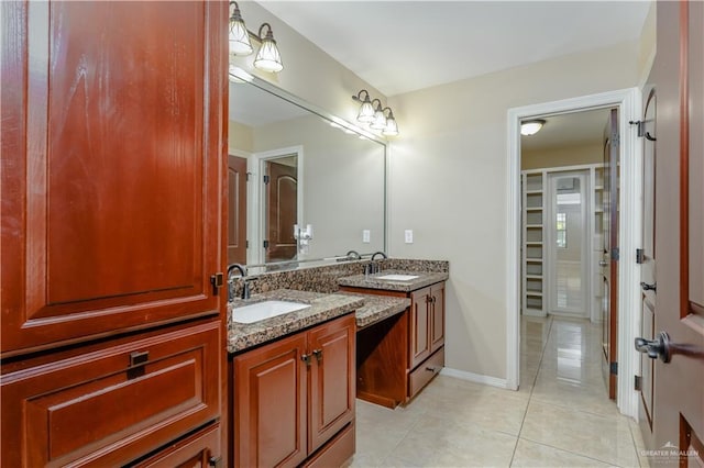 bathroom with tile patterned flooring and vanity