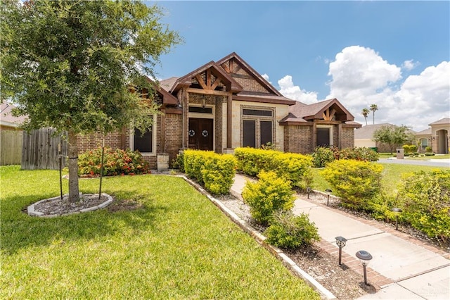 craftsman house with a front lawn