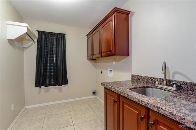 clothes washing area featuring light tile patterned flooring, sink, cabinets, washer hookup, and electric dryer hookup