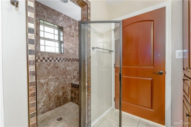 bathroom featuring walk in shower and tile patterned floors