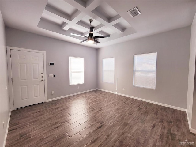 spare room with beam ceiling, ceiling fan, coffered ceiling, and plenty of natural light