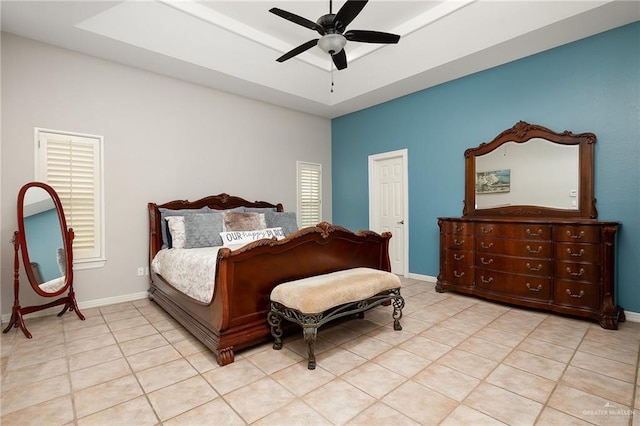 bedroom with ceiling fan and light tile patterned floors