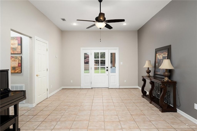 tiled foyer entrance featuring ceiling fan