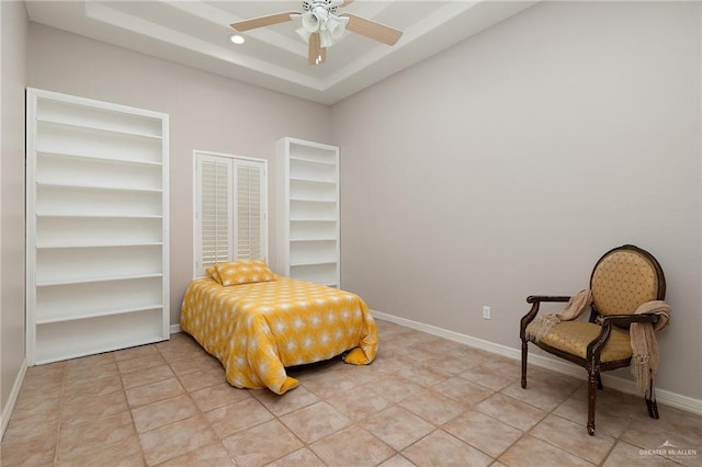 bedroom with ceiling fan and light tile patterned floors