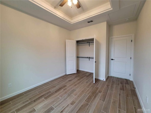 unfurnished bedroom featuring a closet and ceiling fan