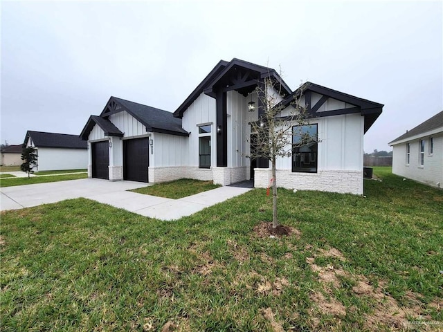 modern farmhouse style home with a garage and a front lawn