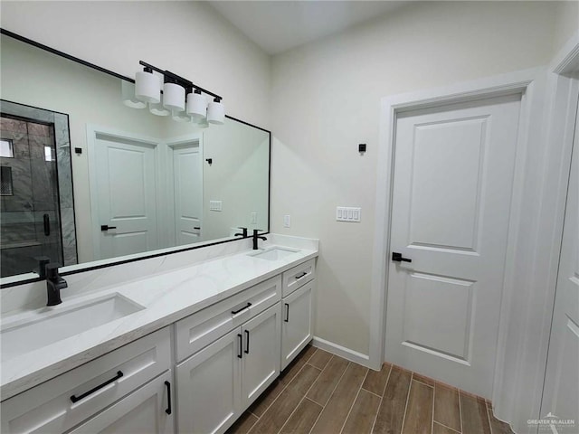 bathroom featuring vanity and a shower with shower door