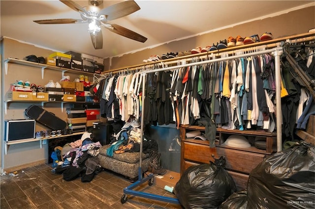 walk in closet with ceiling fan