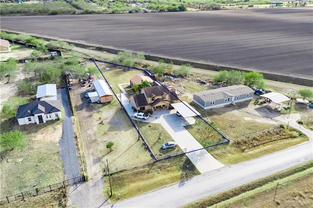 birds eye view of property featuring a rural view