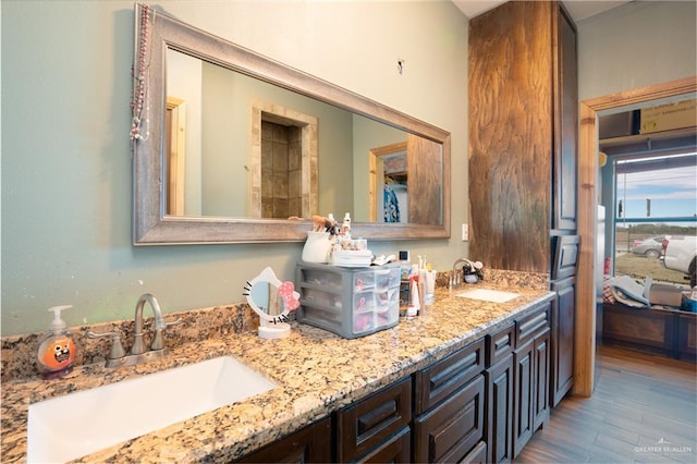 ensuite bathroom with double vanity, a sink, and ensuite bathroom