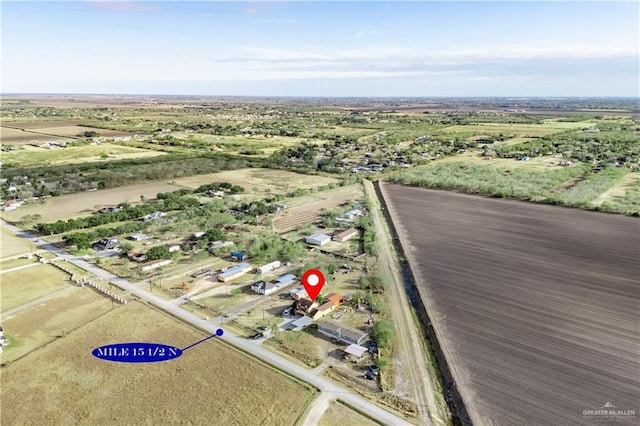 birds eye view of property featuring a rural view