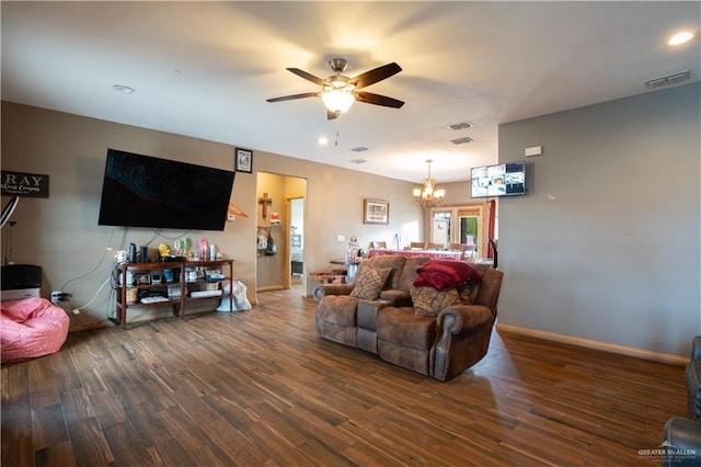 living area with baseboards, visible vents, wood finished floors, ceiling fan with notable chandelier, and recessed lighting