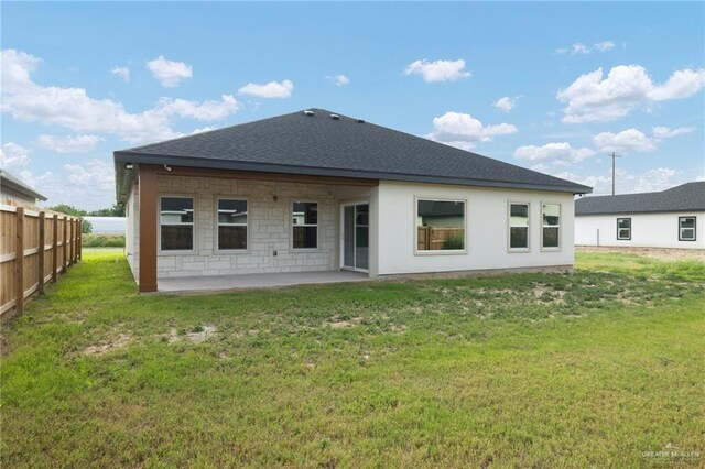 9218 N 25th Ln, Mcallen, TX 78504 - back of property with a patio area and a shingled roof