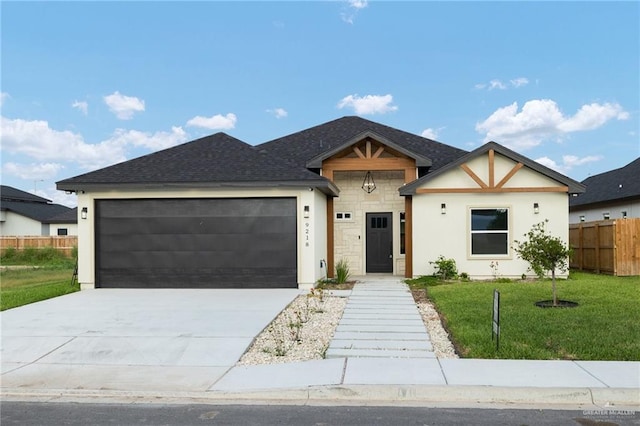 9218 N 25th Ln, Mcallen, TX 78504 - view of front of property featuring a garage, driveway, stucco siding, and roof with shingles