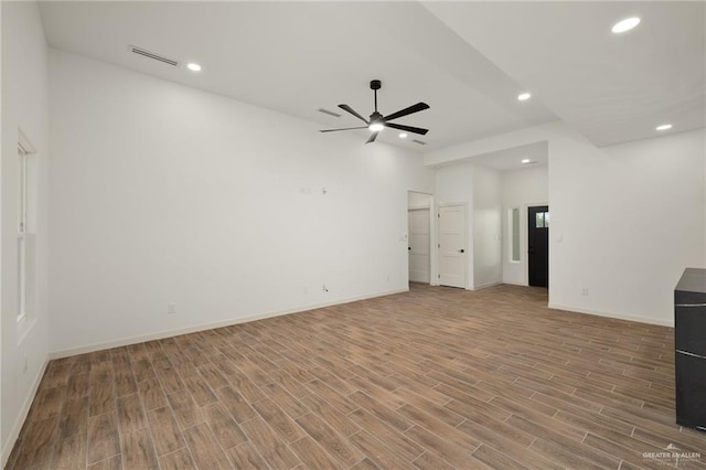 9218 N 25th Ln, Mcallen, TX 78504 - unfurnished living room featuring ceiling fan, light wood-type flooring, recessed lighting, and baseboards