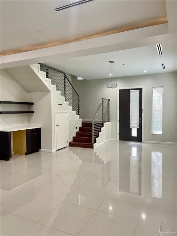 foyer featuring light tile patterned floors