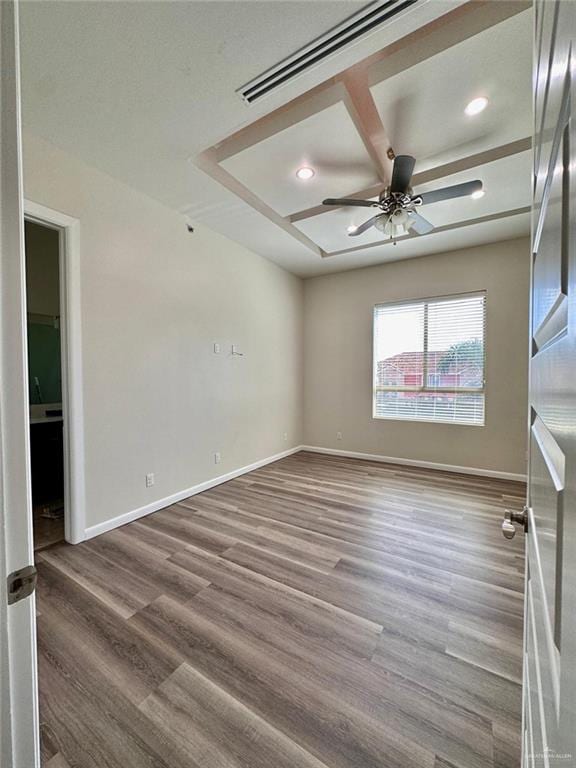 empty room featuring hardwood / wood-style floors and ceiling fan