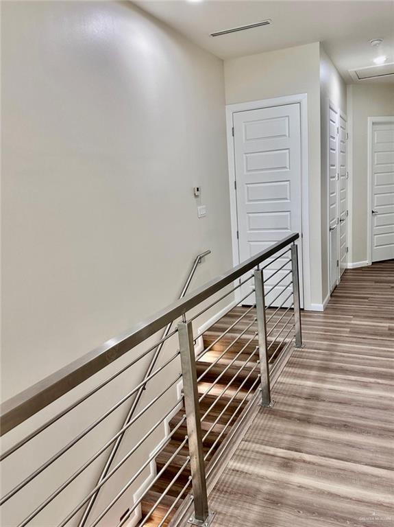 hallway featuring wood-type flooring