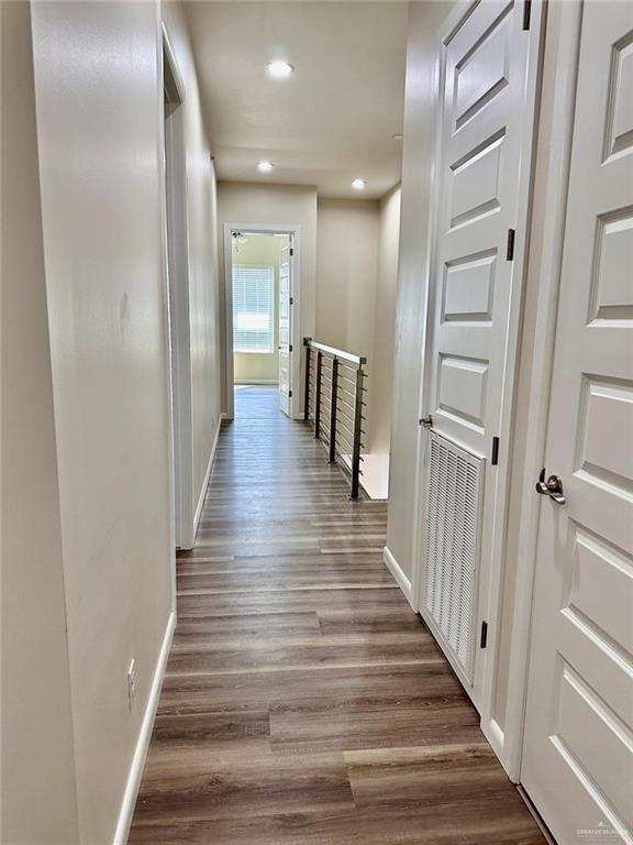 hall with dark hardwood / wood-style floors