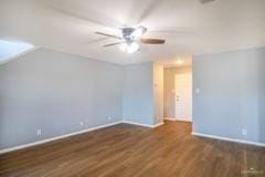 additional living space featuring ceiling fan and dark hardwood / wood-style flooring