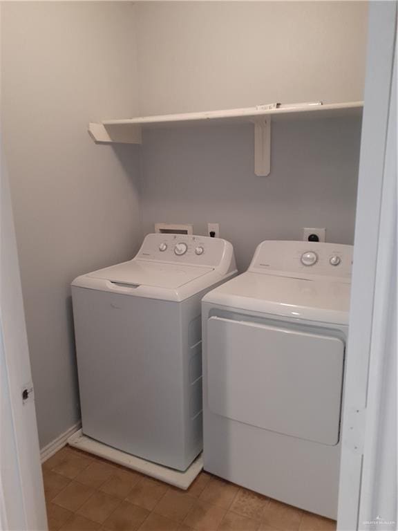 laundry area with washer and clothes dryer