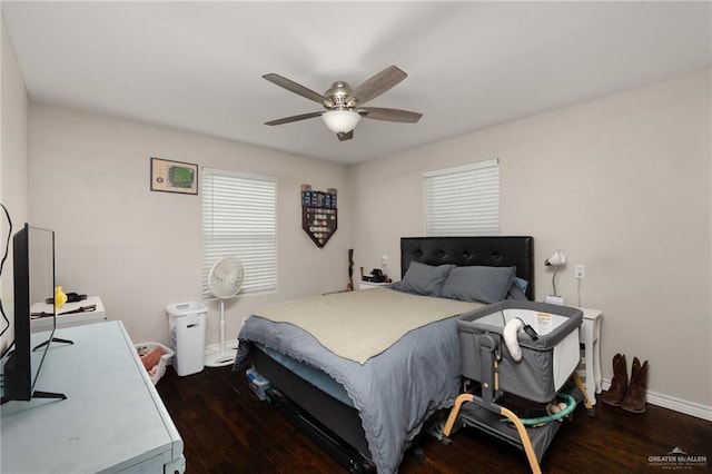 bedroom with dark wood-type flooring and ceiling fan