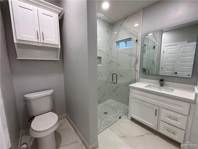 full bath with vanity, toilet, marble finish floor, a marble finish shower, and baseboards