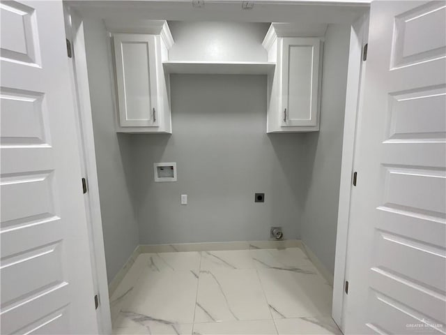 washroom featuring electric dryer hookup, marble finish floor, baseboards, hookup for a washing machine, and laundry area