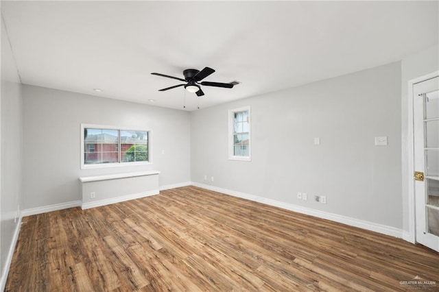 spare room featuring hardwood / wood-style floors and ceiling fan