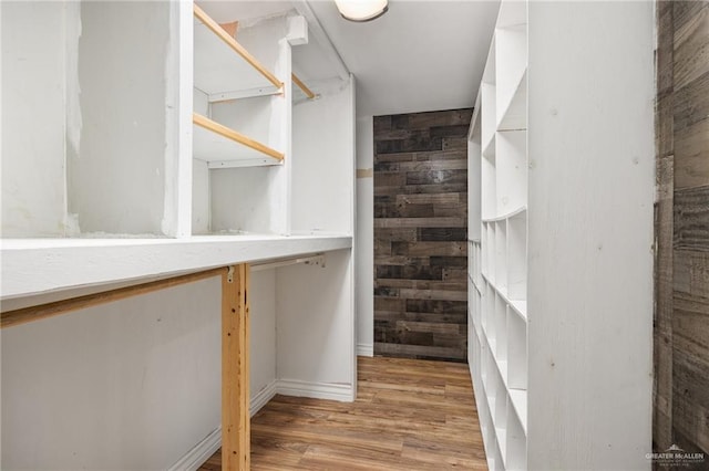 spacious closet featuring light hardwood / wood-style flooring