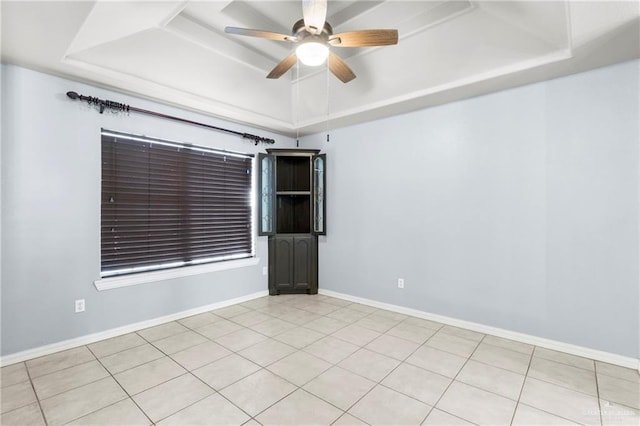1411 Dons Dr, Mission, TX 78572 - unfurnished room featuring a tray ceiling, a ceiling fan, and baseboards
