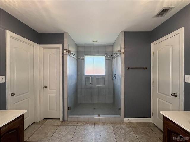 2700 Duke Ave, Mcallen, TX 78504 - full bath featuring vanity, a stall shower, baseboards, and tile patterned flooring