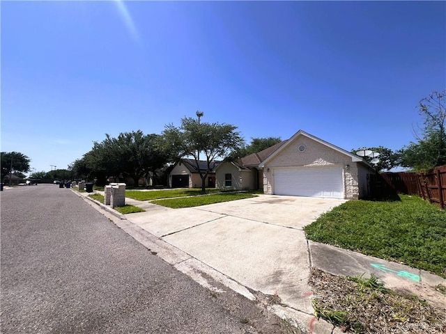 2700 Duke Ave, Mcallen, TX 78504 - view of front facade with a garage and driveway