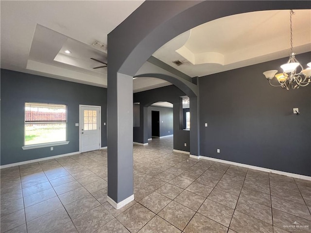 2700 Duke Ave, Mcallen, TX 78504 - unfurnished room with a tray ceiling, a chandelier, tile patterned flooring, and recessed lighting