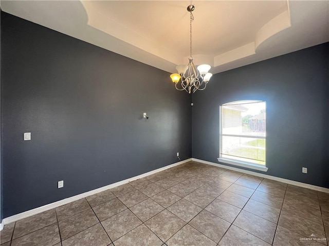 2700 Duke Ave, Mcallen, TX 78504 - empty room with a raised ceiling, tile patterned floors, a chandelier, and baseboards