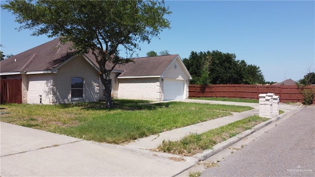 2700 Duke Ave, Mcallen, TX 78504 - view of home's exterior with concrete driveway and a garage
