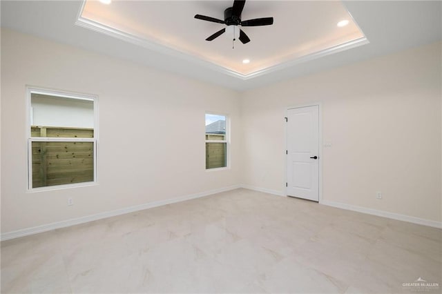 1809 Diplomat Dr, Edinburg, TX 78542 - empty room with a tray ceiling, baseboards, a ceiling fan, and recessed lighting