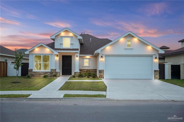 1809 Diplomat Dr, Edinburg, TX 78542 - view of front of property featuring stone siding, an attached garage, stucco siding, a front yard, and driveway