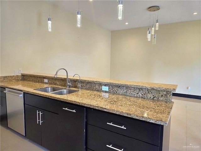 kitchen featuring sink, hanging light fixtures, light stone counters, light tile patterned flooring, and stainless steel dishwasher