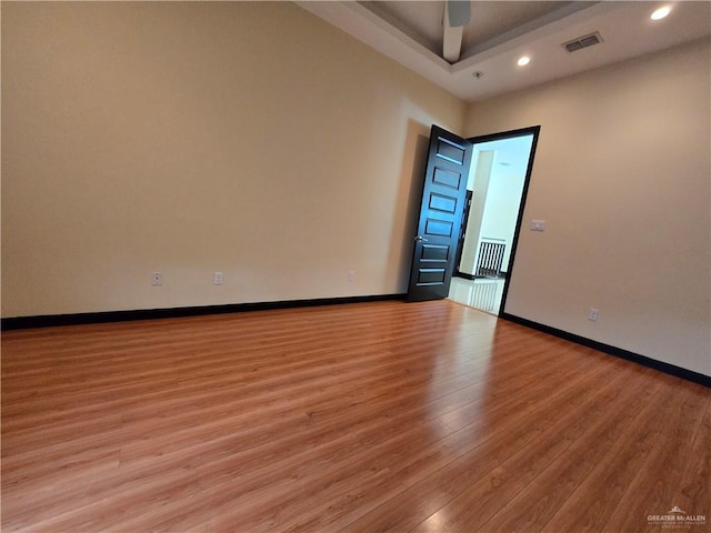 spare room featuring ceiling fan and light wood-type flooring